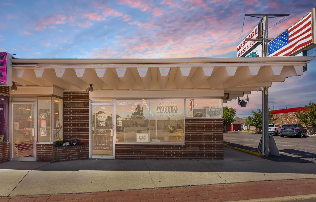 Authorized Vacuum Company storefront at dusk on East Lincolnway, Cheyenne